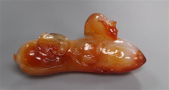 A Chinese carved chalcedony model fruit and rat